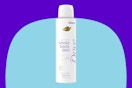 Dove spray deodorant on a blue background.