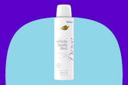 Dove spray deodorant on a blue background.