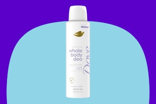 Dove spray deodorant on a blue background.