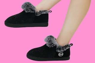 Stock image of black Ecetana Women's Slippers being worn by model (close up)