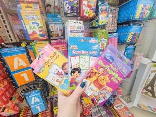 hand holding 3 sets of flash cards