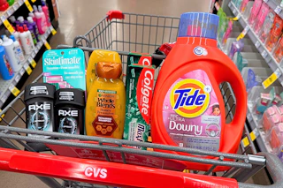 axe deodorant, skintimate razors, garnier shampoo, colgate toothpaste, and tide detergent in a cart
