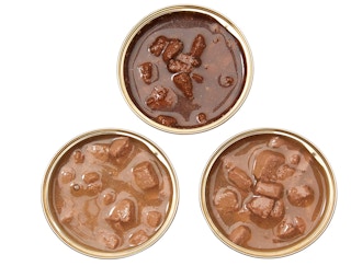 Three cans of wet cat food on a white background