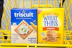 wheat thins and triscuit crackers in yellow shopping cart