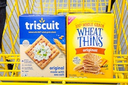 wheat thins and triscuit crackers in yellow shopping cart