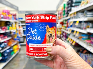 hand holding a can of pet pride dog food