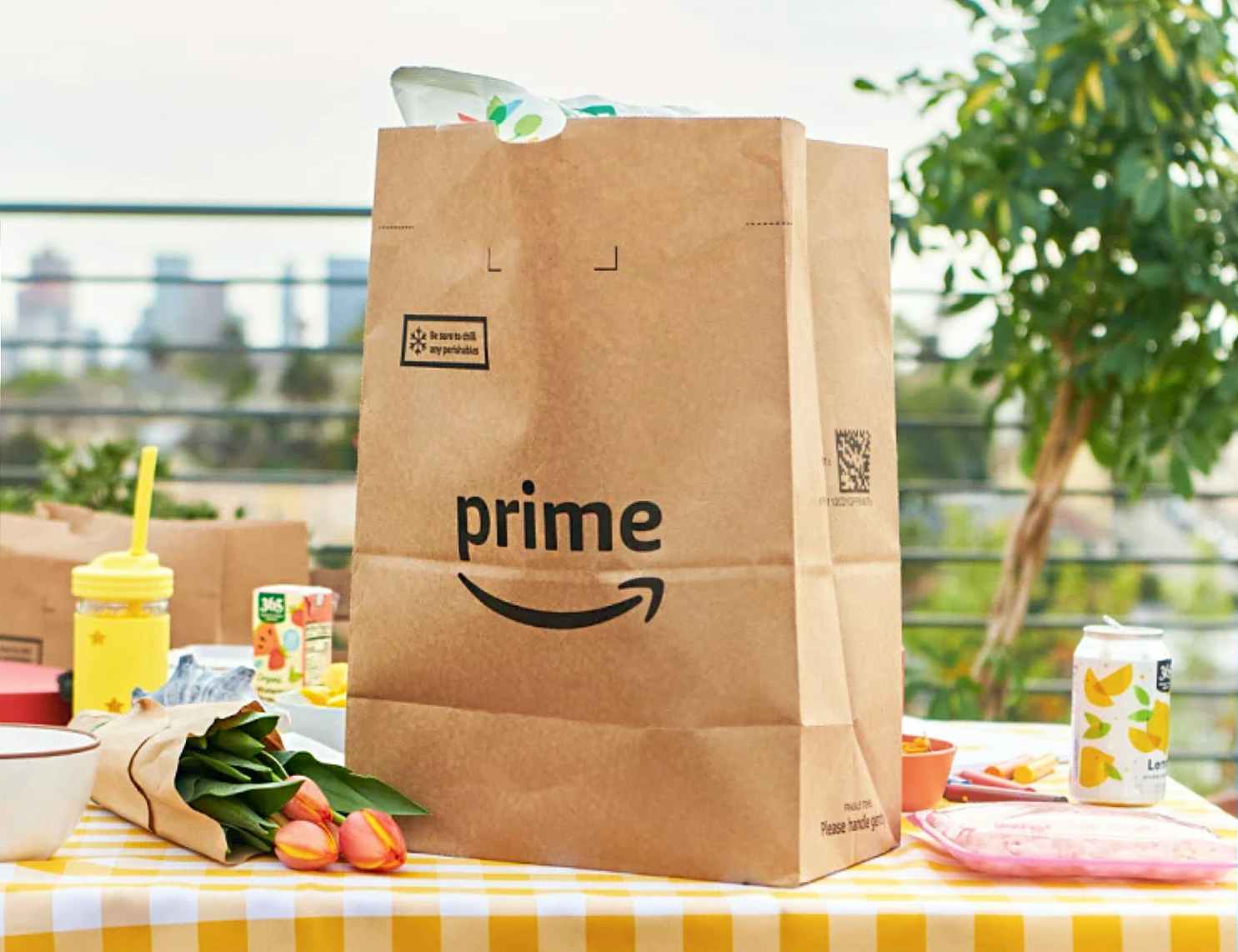 amazon prime bag on picnic table with flowers