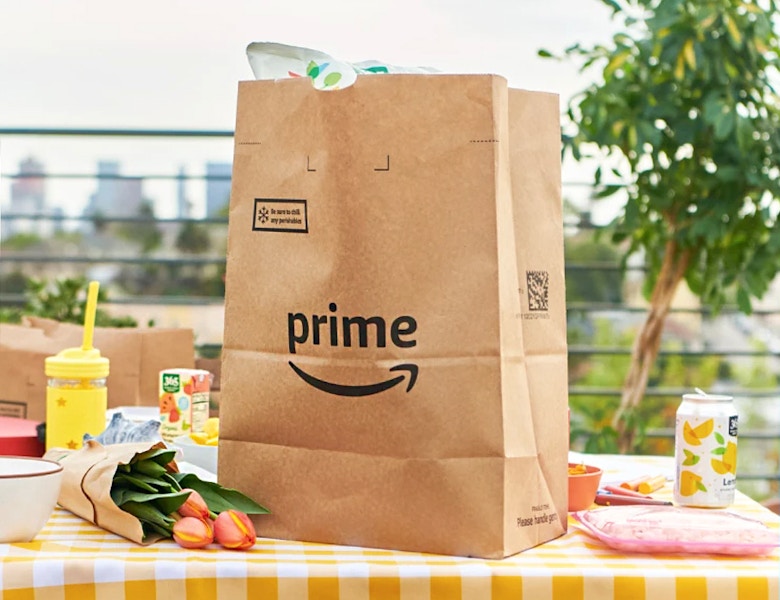 amazon prime bag on picnic table with flowers