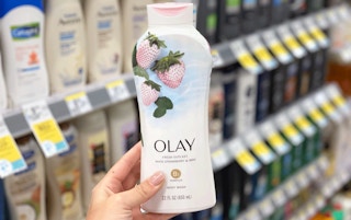 hand holding a bottle of Olay body wash