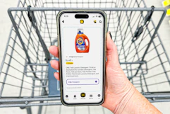 hand holding a smartphone displaying a 1-clip coupon in the kcl app