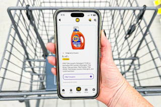 hand holding a smartphone displaying a 1-clip coupon in the kcl app