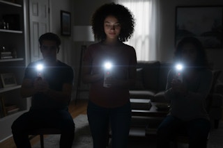 a group of people using flashlights