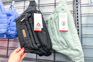 Reebook fanny packs at Walmart on clothing rack