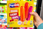 hand holding a box of popsicle ice pops
