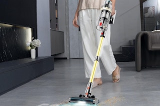 Woman using the Linkifly Cordless Vacuum Cleaner on hardwood floors.