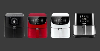Some recalled models of Cosori air fryers on a dark grey background