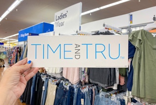 Time and Tru Logo held in front of ladies apparel at Walmart