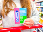 hand holding a benadryl anti-itch cream at target