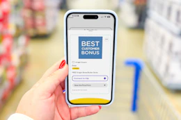 hand holding a smartphone displaying a 1-clip coupon in the kcl app