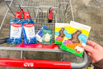 cvs shopping cart with colgate, ecotools, and russell stover products