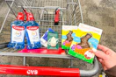 cvs shopping cart with colgate, ecotools, and russell stover products