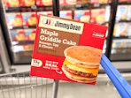 a box of jimmy dean griddle cakes on walmart cart in freezer aisle
