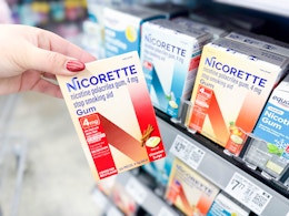 hand holding a box of Nicorette gum