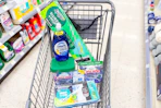 home cleaning products in a walgreens shopping cart