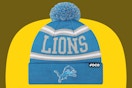 Detroit Lions winter beanie hat on a yellow and olive background.