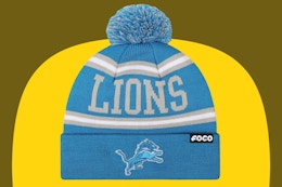 Detroit Lions winter beanie hat on a yellow and olive background.