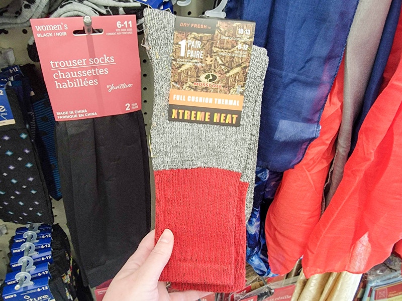 hand holding a pair of thermal socks