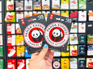 hand holding up two $25 panda express gift cards