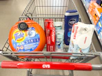 tide pods, colgate toothpaste, degree deodorant, nivea body wash, and huggies wipes in a cart