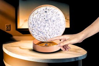 Lifestyle image of the Bell+Howell Lenox Table Lamp being turned on/off (close up for hand)