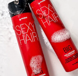 two red bottles of shampoo and conditioner