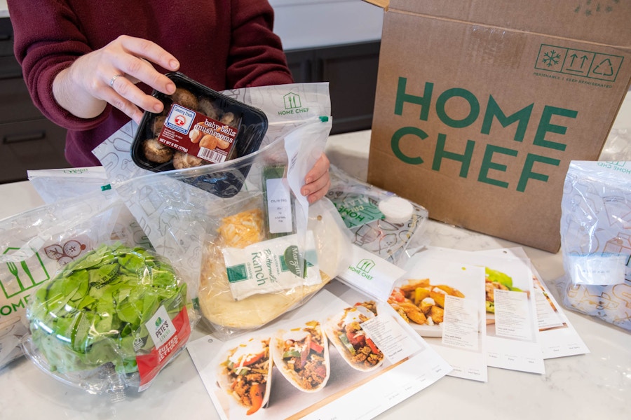 A person pulling mushrooms from a Home Shelf package showing everything individually wrapped and evenly portioned.