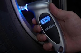 a tire pressure gauge on a tire