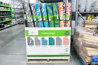 Sidderent styles of patio rugs at Walmart store