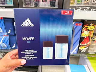 hand holding Adidas Moves for him gift set box