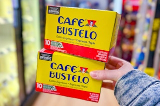 hand holding cafe bustelo coffee pod boxes