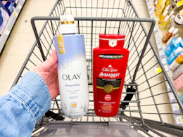 hand holding olay and old spice body wash in walgreens