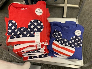 celebrate it disney shirts folded on shelf