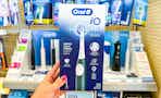 hand holding oral b electric toothbrush in walgreens