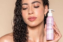 a woman holding the pacifica hair mask
