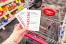 person holding 2 packs of thayers acne patches over a cart