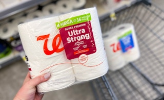 hand holding walgreens ultra strong toilet paper