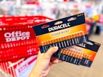 office depot basket and hand holding duracell batteries