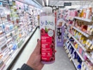 hand holding st. ives body wash in walgreens