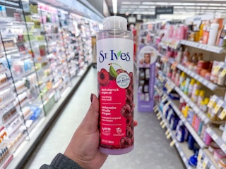 hand holding st. ives body wash in walgreens