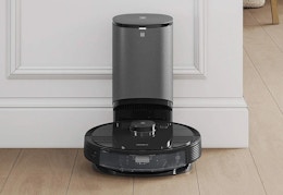 black robot vacuum and mop with self-emptying station